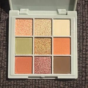Mystic Earth Vibrant 9-Color Eyeshadow Palette with Gold and Orange Hues